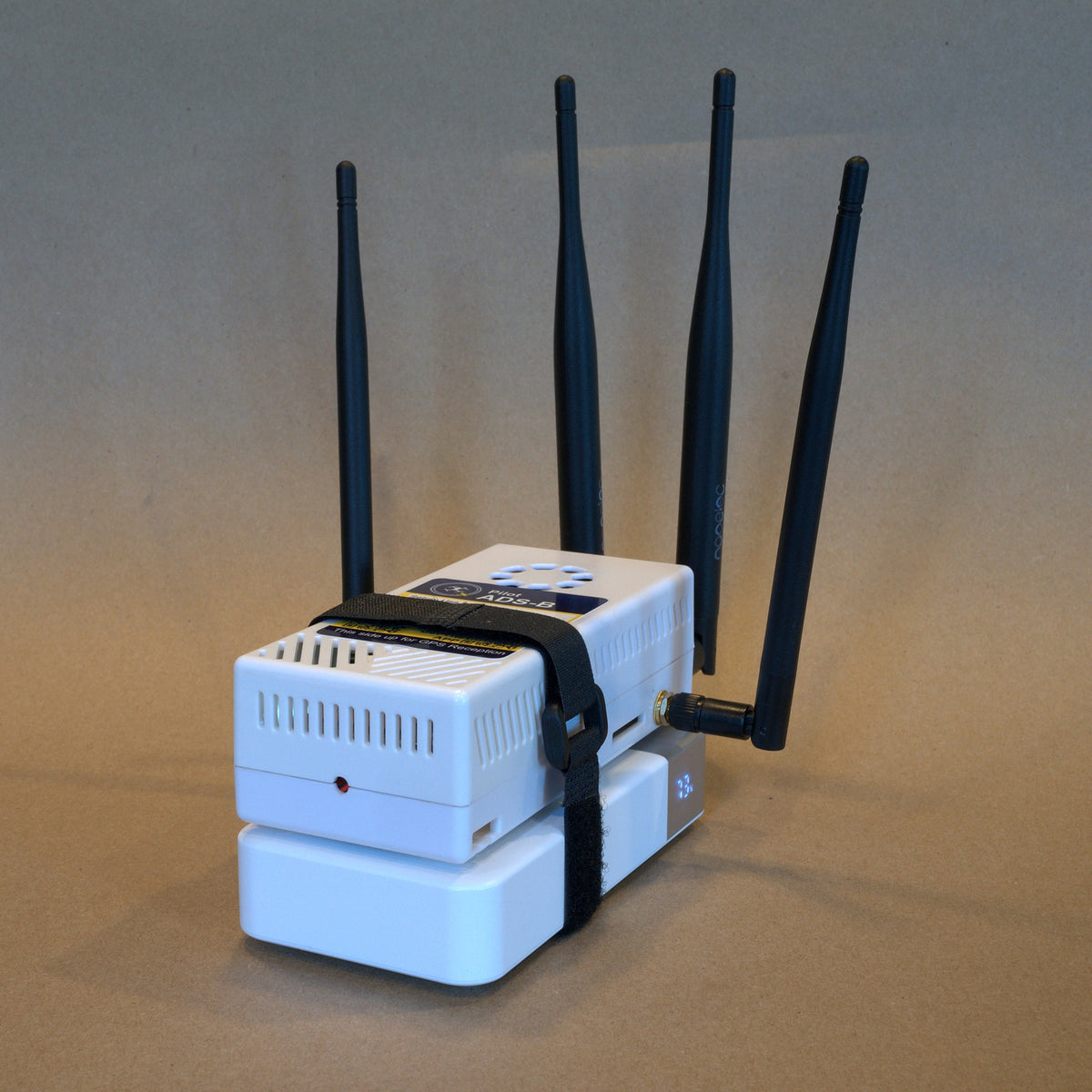 Three-quarter view of the Remote ID receiver, shown on the Deluxe kit battery (battery not included)