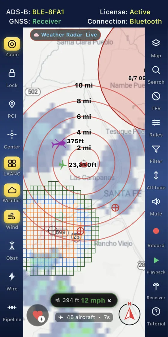 Drone Pilot ADS-B showing a helicopter and an airliner inside the range rings, with a TFR and the LAANC grid nearby