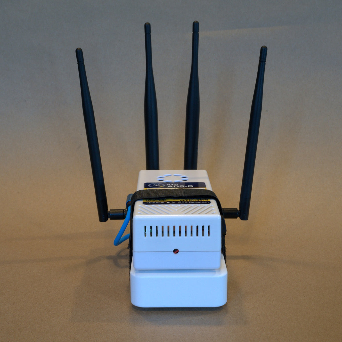 Back of the Remote ID receiver with all four antennas, shown on the Deluxe kit battery (battery not included)