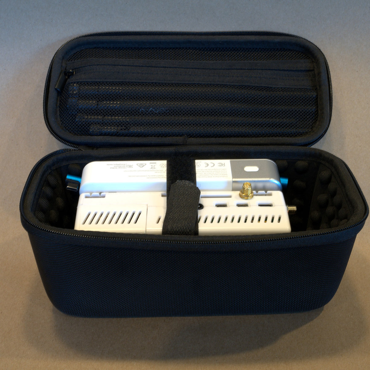 The receiver and battery packed in the open carry case